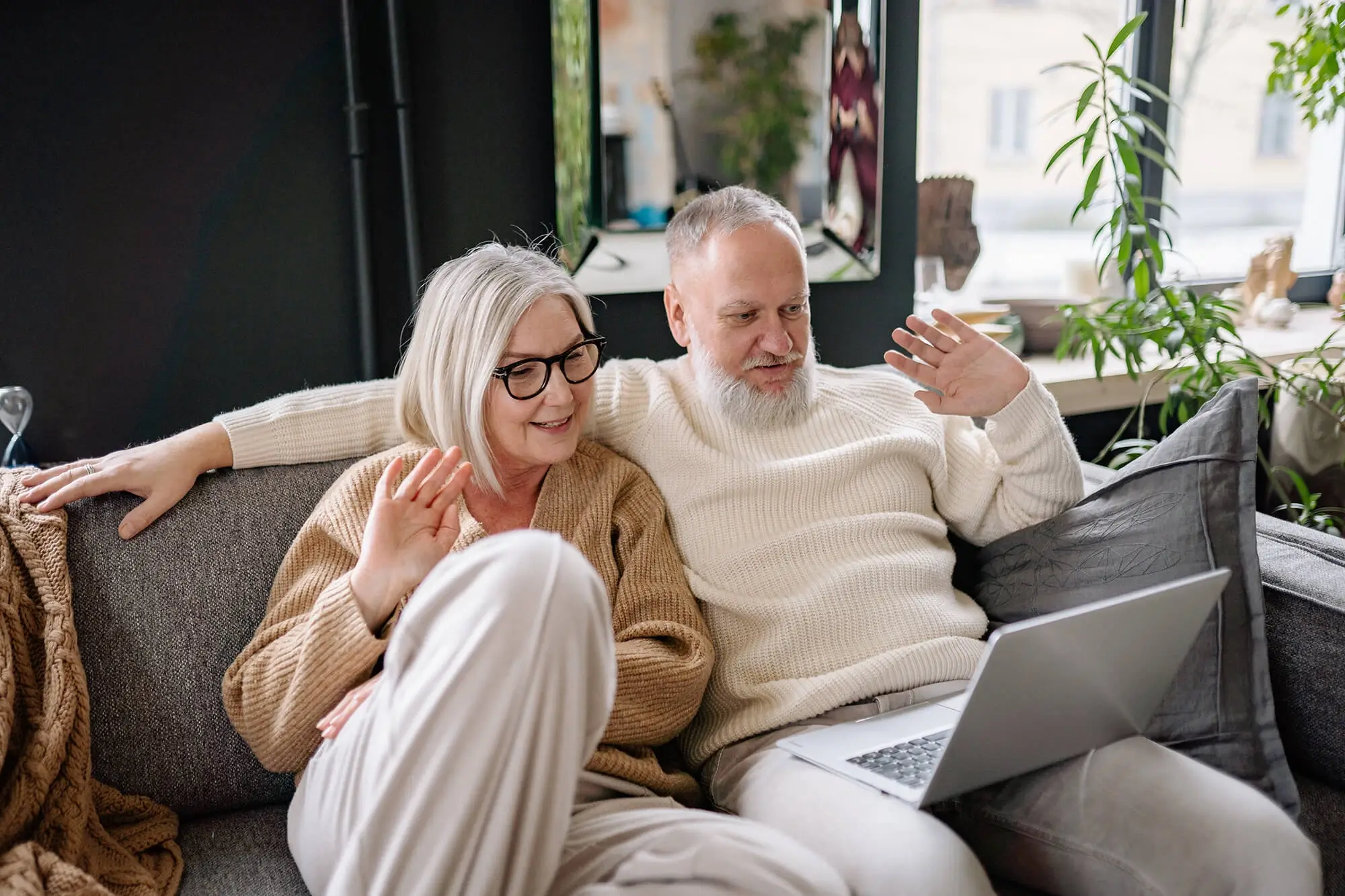 Couple looking at laptop